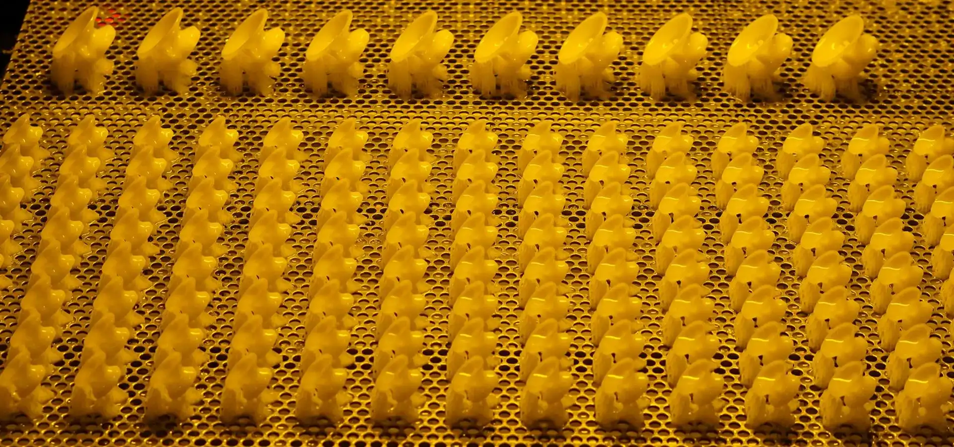 High-resolution Stereolithography 3D printer build plate featuring an array of microfluidic prototypes, showcasing the large build volume capability to support batch and multi-device prototyping requirements.