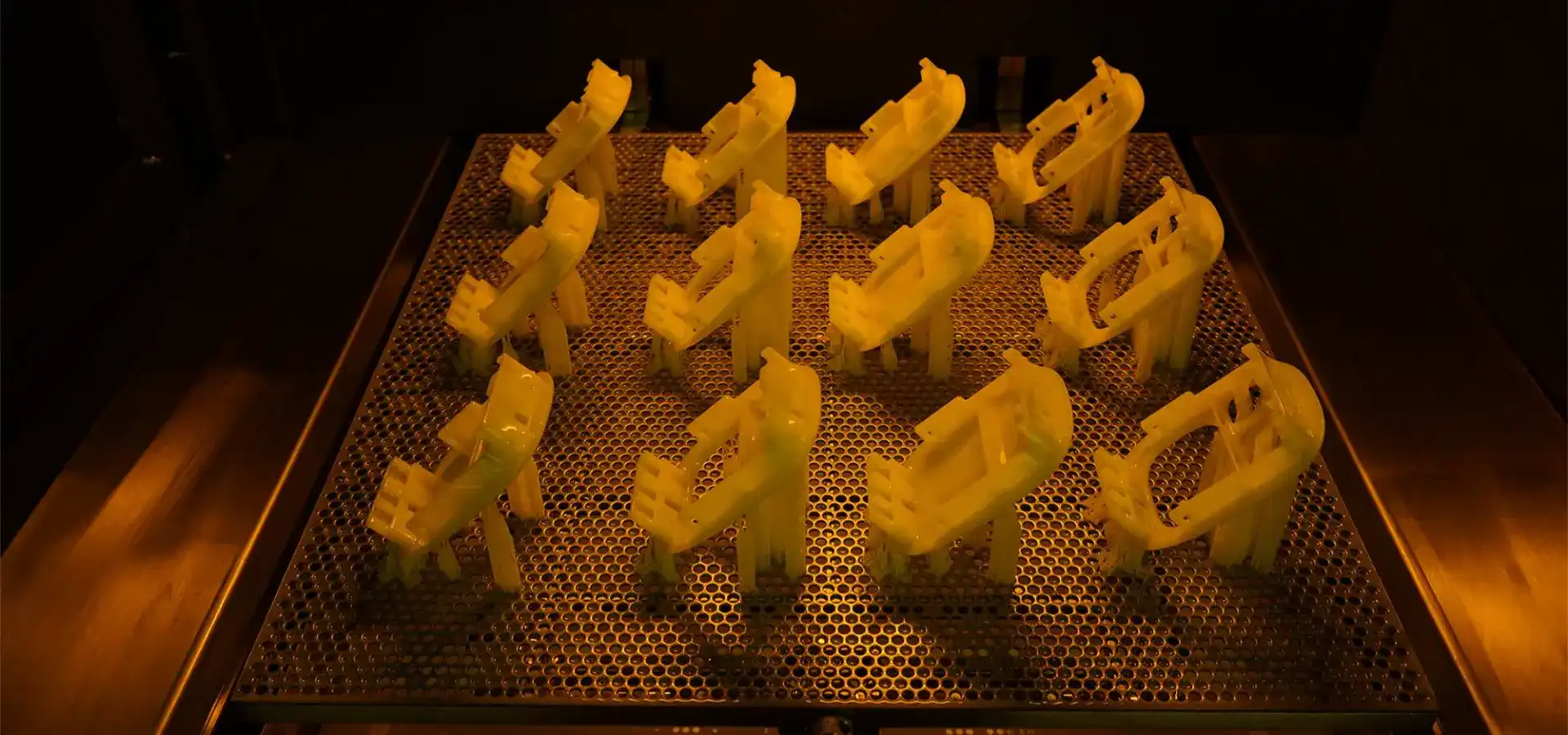High-precision parts produced by an SLA printer on a large-format build plate, showcasing the efficiency of stereolithography 3D printing for high-volume prototyping.