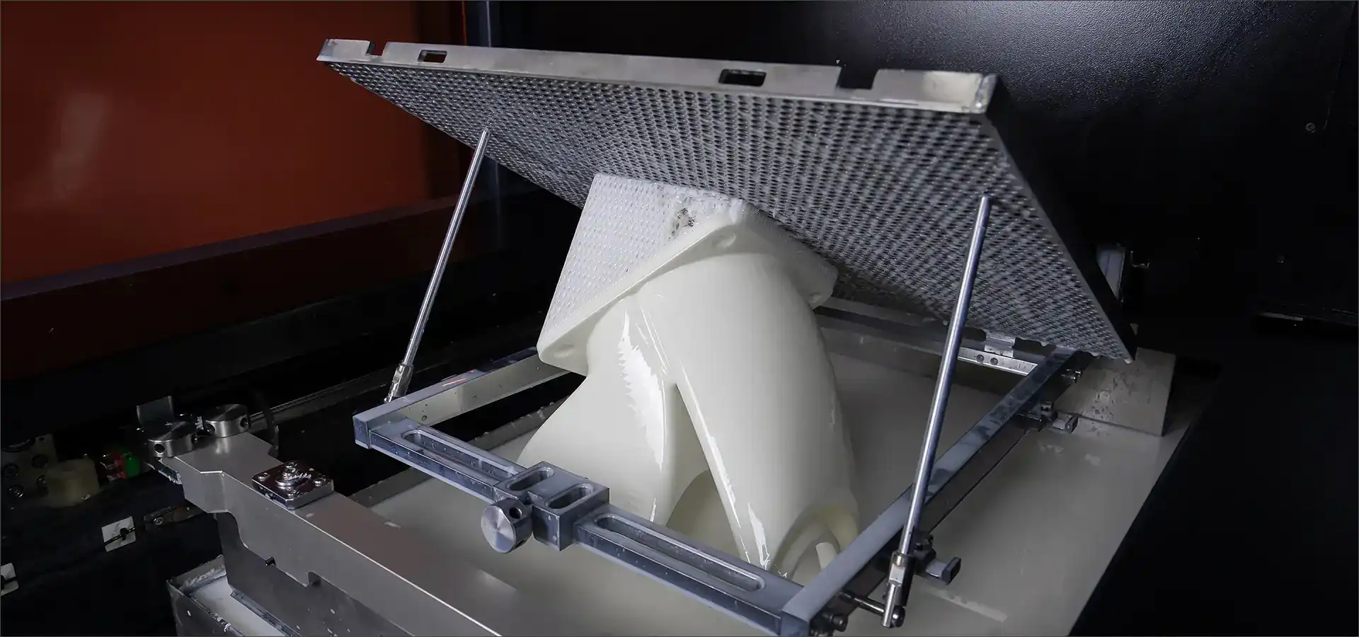 Stereolithography 3D printer curing liquid photopolymer resin during printing process