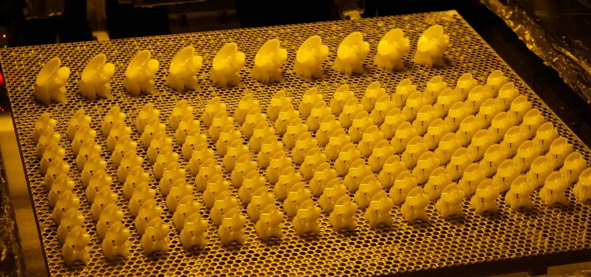 Engineer evaluating industrial SLA 3D printer build volume and production capability