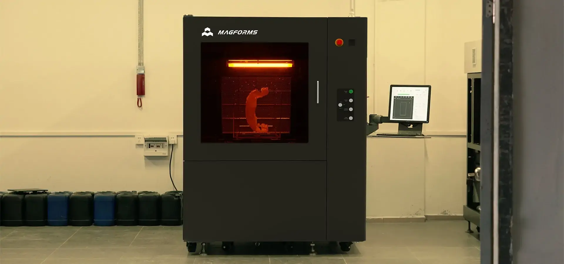 Industrial SLA 3D printer producing high precision resin parts in manufacturing environment Industrial SLA 3D printer producing high precision resin parts in manufacturing environment