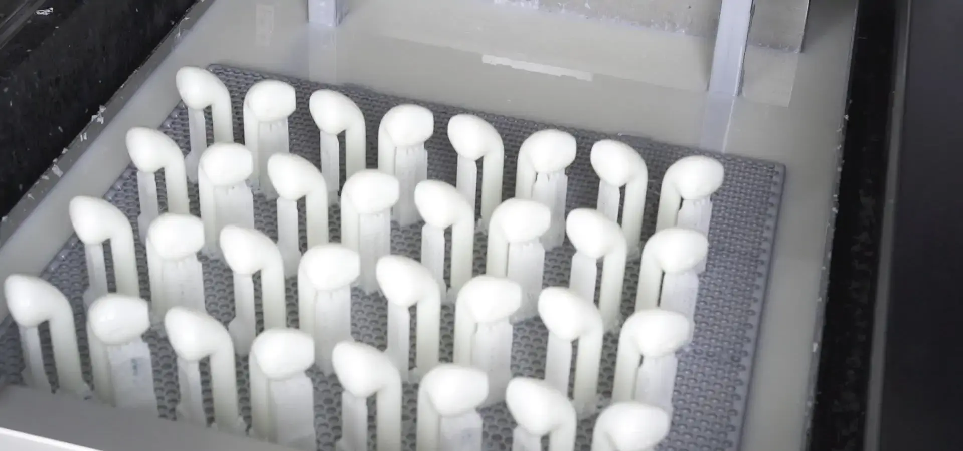 SLA printer curing resin layer by layer during printing process