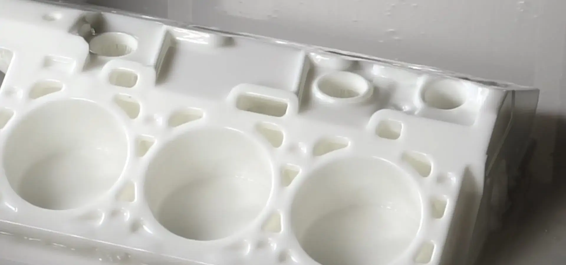 Industrial stereolithography 3D printer producing high-precision resin parts with smooth surface finish