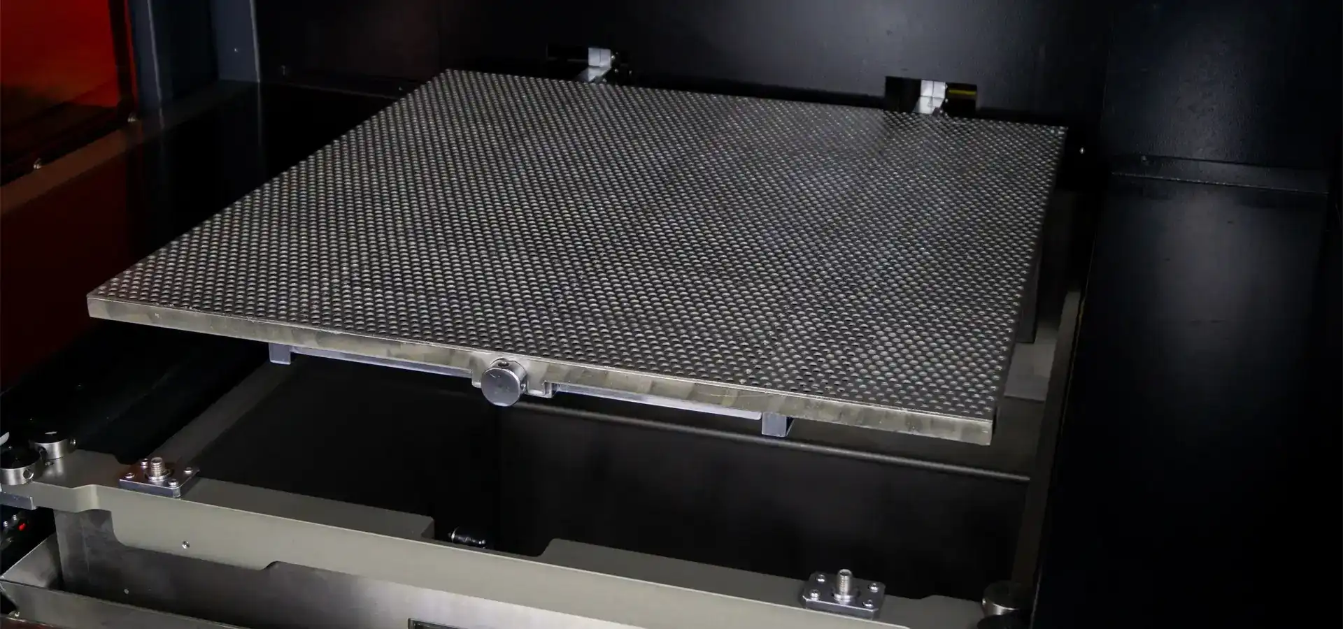 Large build platform inside a big format SLA 3D printer designed for industrial manufacturing Large build platform inside a big format SLA 3D printer designed for industrial manufacturing
