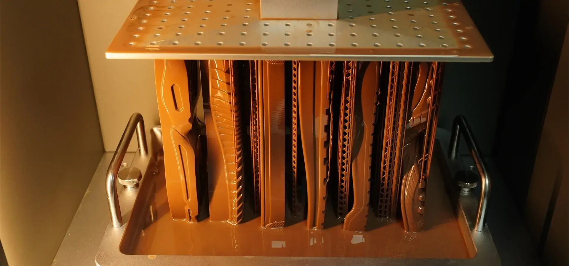 Large format resin 3D printer producing multiple shoe lasts in batch Large format resin 3D printer producing multiple shoe lasts in batch