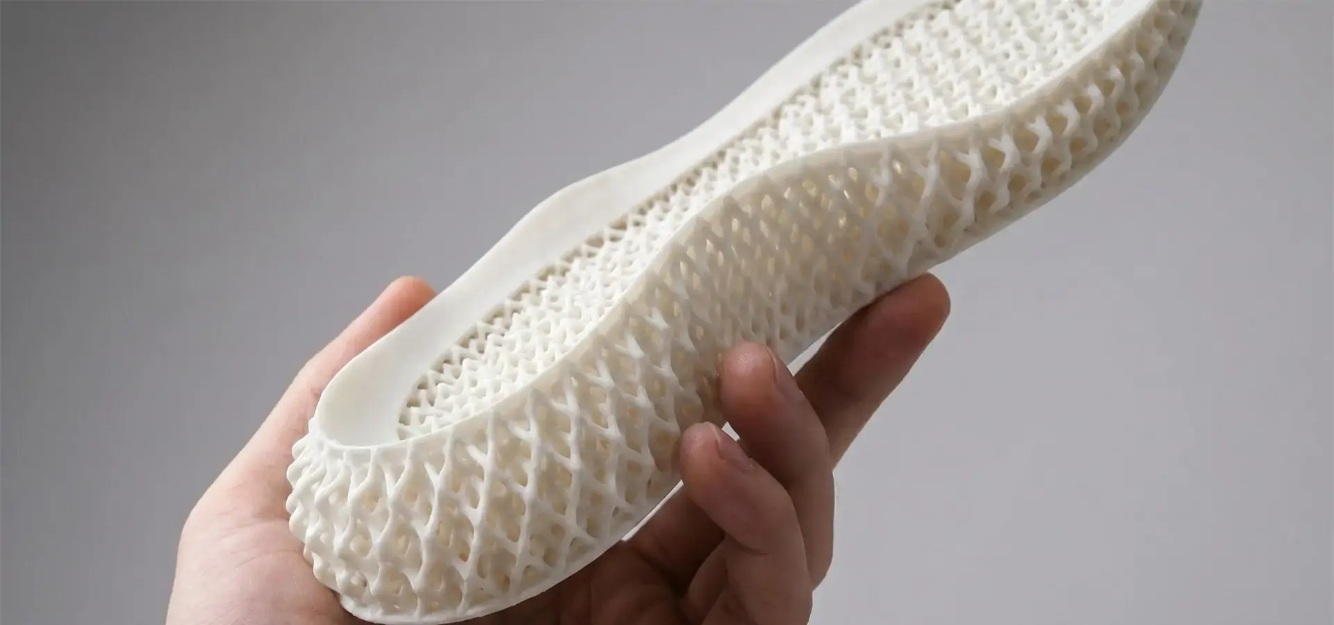 SLA shoe 3D printer fabricating a custom lattice midsole from elastomeric photopolymer