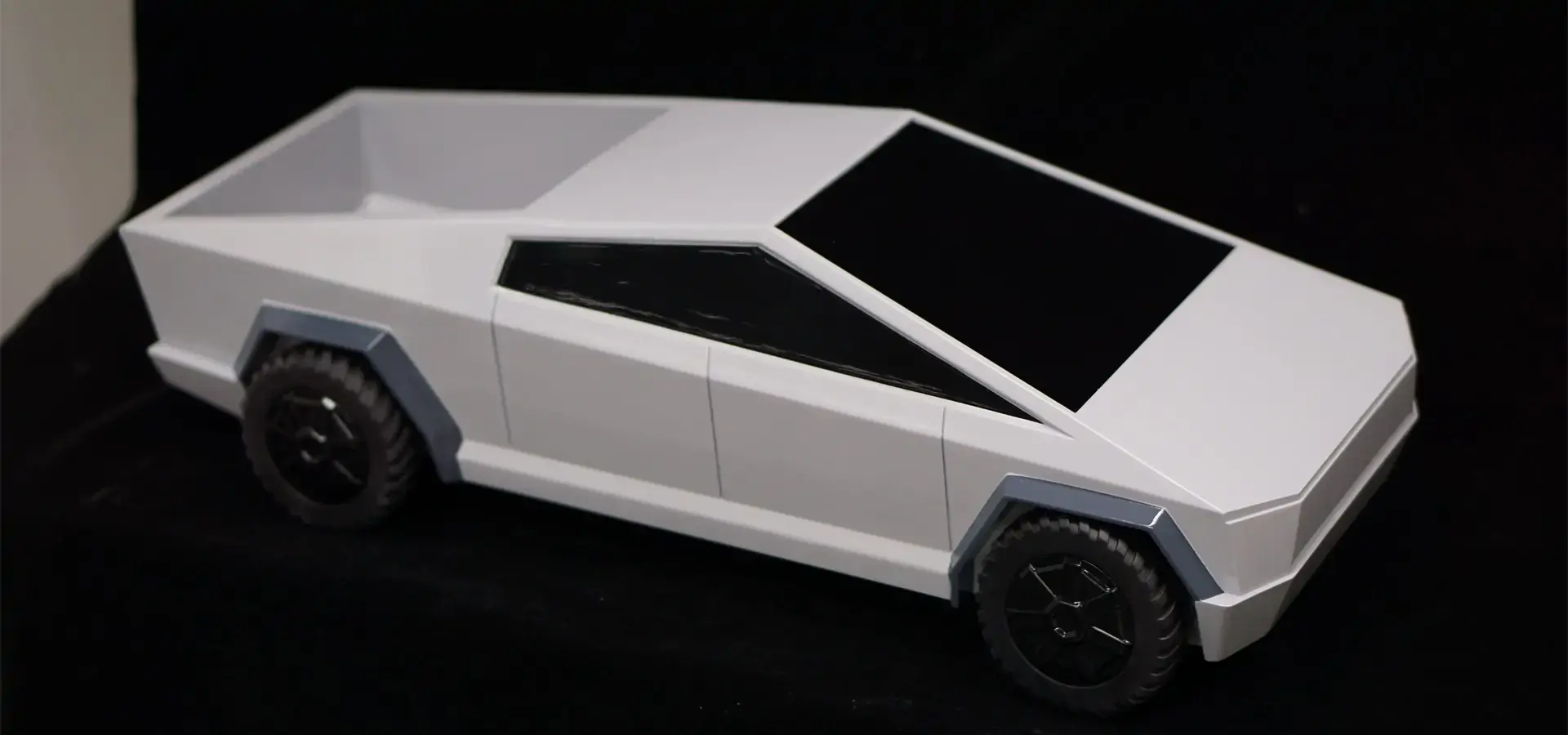 Automotive engineers evaluating prototypes produced by a 3D printing machine Automotive engineers evaluating prototypes produced by a 3D printing machine