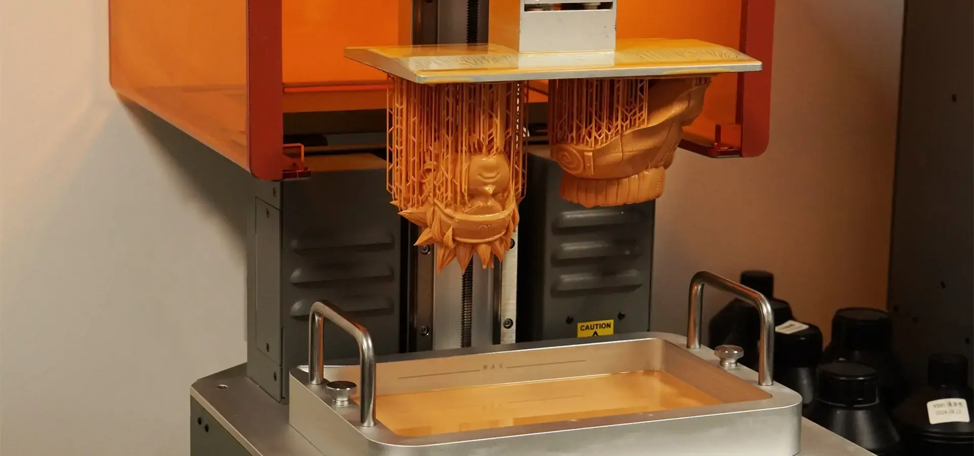 Desktop low-cost SLA printer in operation, showing resin vat and build platform Desktop low-cost SLA printer in operation, showing resin vat and build platform