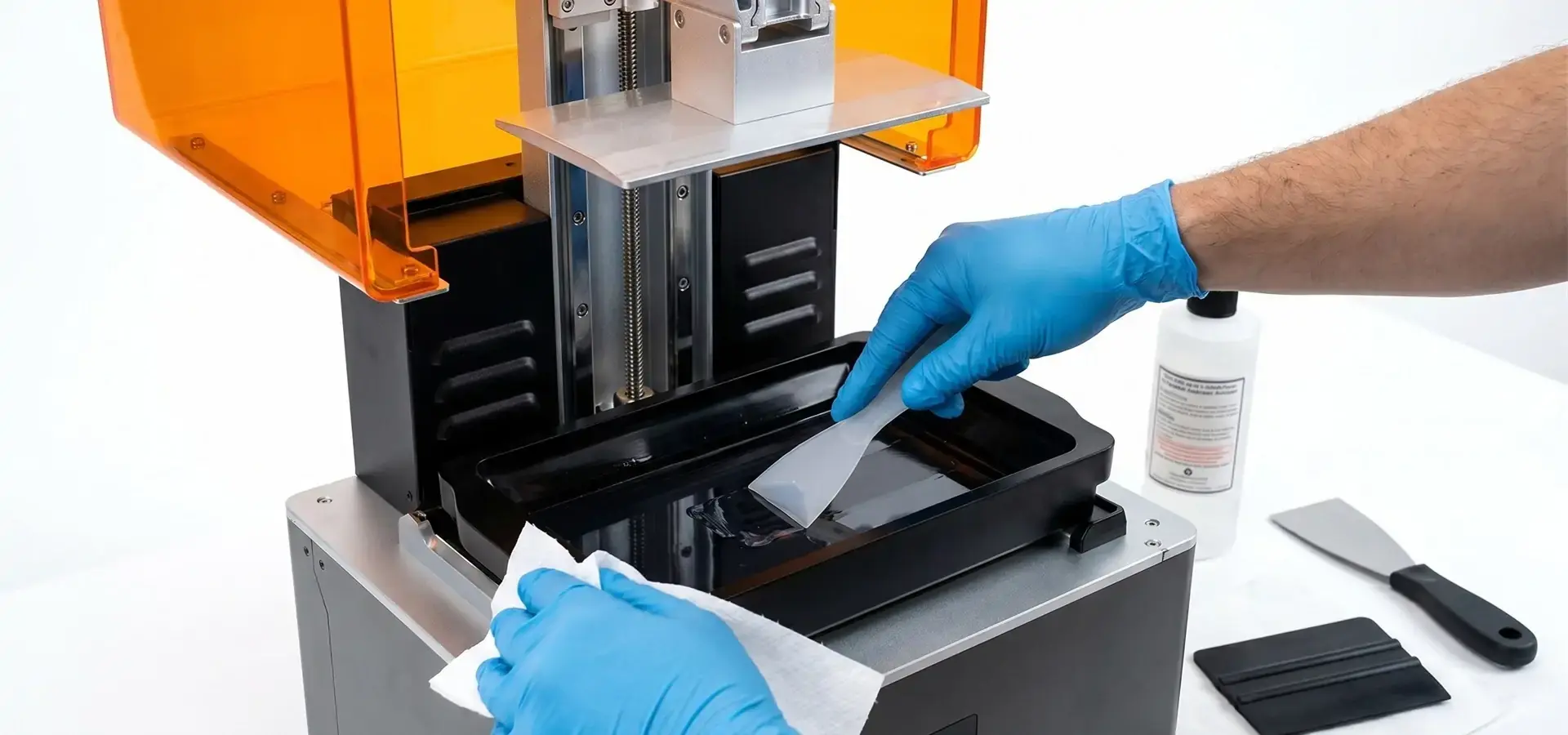 Technician maintaining a monochrome LCD Budget SLA printer Technician maintaining a monochrome LCD Budget SLA printer