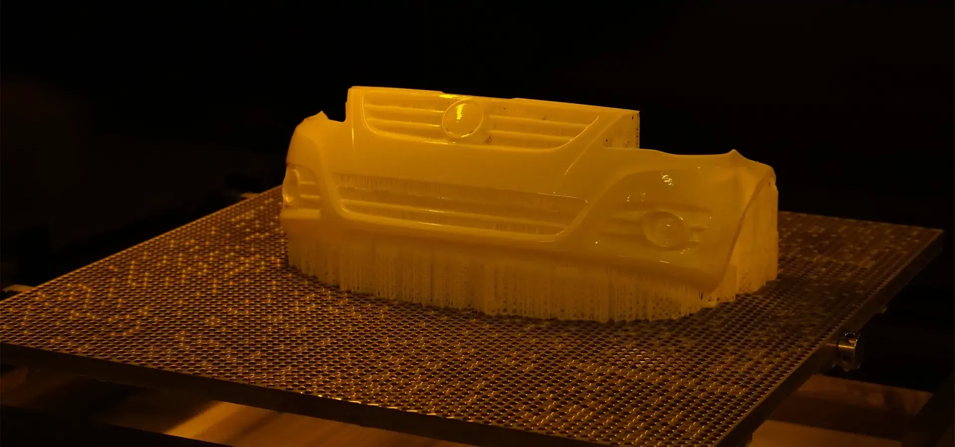Full-size automotive bumper prototype produced on a Big format SLA 3D printer Full-size automotive bumper prototype produced on a Big format SLA 3D printer